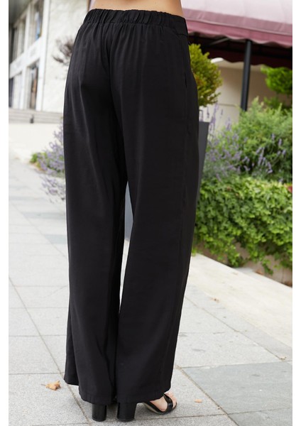 Kadın Ipeksi Modal Kumaş Yüksek Bel Beli Lastikli Apoletli Yan Cepli Bol Paça Palazzo Pantolon-Siyah indirimleri