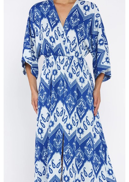 Kadın Kruvaze Yaka Bel Lastikli Yarasa Kol Yırtmaç Detaylı Desenli Elbise P-00017808 fırsatları