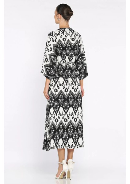 Kadın Kruvaze Yaka Bel Lastikli Yarasa Kol Yırtmaç Detaylı Desenli Elbise P-00017808 modelleri