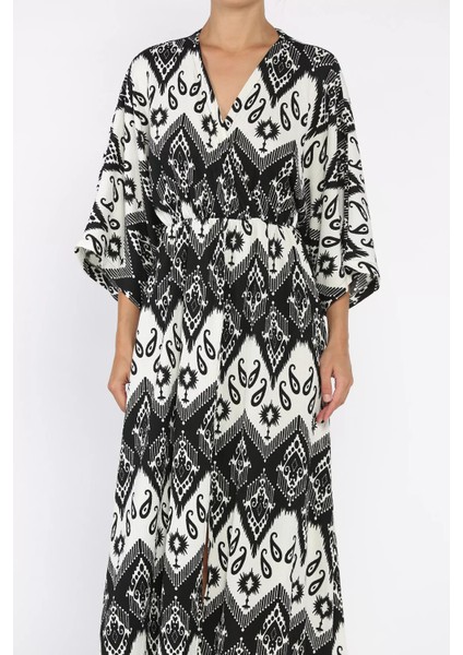 Kadın Kruvaze Yaka Bel Lastikli Yarasa Kol Yırtmaç Detaylı Desenli Elbise P-00017808 fırsatları