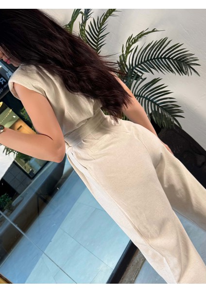 Tristen Kruvaze Yaka Sıfır Kol Vatkalı Kemerli Keten Tulum Taş modelleri