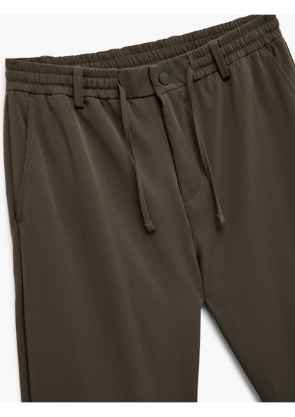 Beli Bağcıklı Düğmeli Duble Paça Esnek Slim Fit Pantolon modelleri