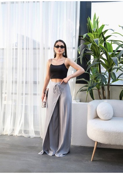 Keten Önü Çapraz Parçali Lasti̇kli̇ ve Bağcikli Geni̇ş Paça Pantolon