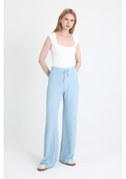 Mavi Geniş Paça Dökümlü Bürümcük Kumaş Pantolon 326 fiyatları