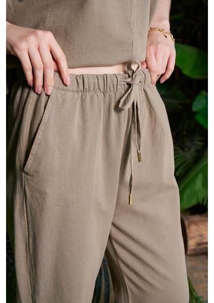 Beli Lastikli ve Bağcıklı Cepli Mom Fit Kadın Keten Havuç Pantolon Yeşil indirimleri