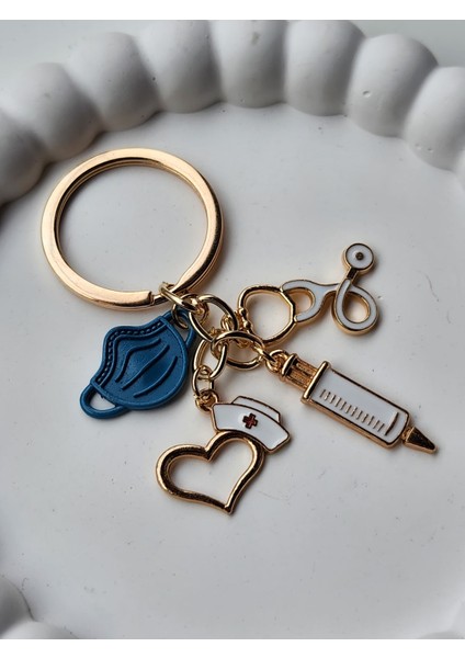 - 🩺 Medikal Temalı Altın Kaplama Çanta Charmı – Doktor Hemşire Figürlü Anahtarlık Aksesuarı fiyatları