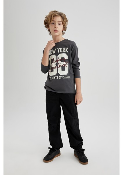 Erkek Çocuk Beli ve Paçası Lastikli Cepli Siyah Jogger Paraşüt Basic Düz Pantolon B6602A824SM fiyatları