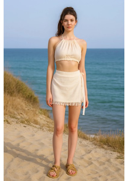 Müslin Yandan Bağlama Detaylı Püsküllü Şort Etek indirimleri