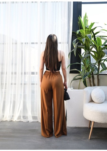 Ipeksi Keten Önü Çapraz Parçali Lasti̇kli̇ ve Bağcikli Geni̇ş Paça Pantolon fiyatları