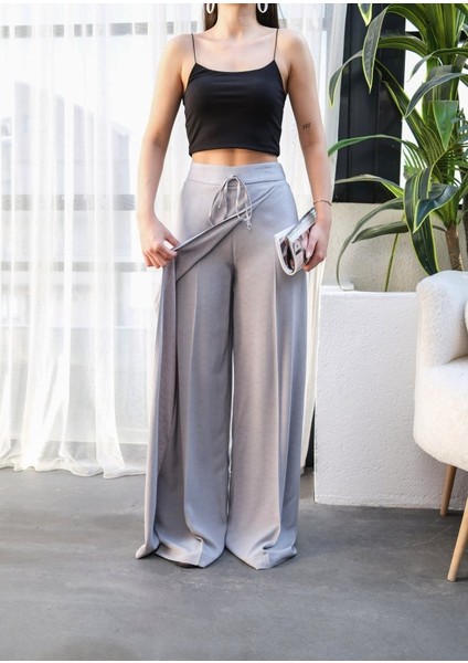 Ipeksi Keten Önü Çapraz Parçali Lasti̇kli̇ ve Bağcikli Geni̇ş Paça Pantolon modelleri