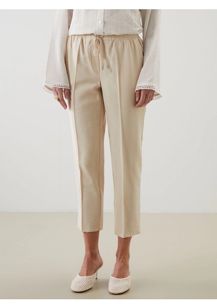 Lcw Modest Bej Beli Lastikli Havuç Kesim Kadın Pantolon fiyatları