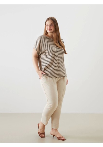 Lcw Modest Bej Beli Lastikli Havuç Kesim Kadın Pantolon modelleri