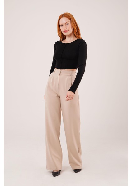 Ipeksi Bol Paça Piliseli Bej Pantolon indirimleri