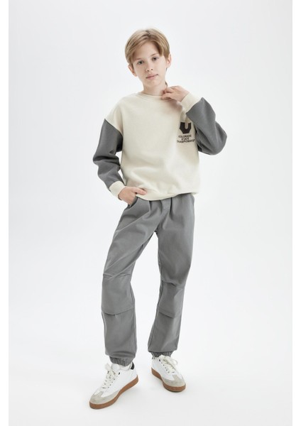 Erkek Çocuk Bağcıklı Beli ve Paçası Lastikli Cepli Jogger Gabardin Pantolon C7577A824WN fiyatları