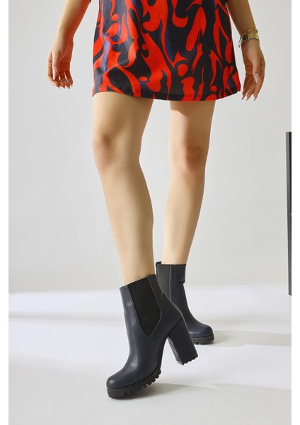 Dorsaf Lacivert Oval Burunlu Lastikli Topuklu Bot fiyatları