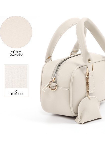 Krem SHK207 Suni Deri Charm Detaylı Fermuarlı Ayarlanabilir Askılı El, Kol ve Omuz Çantası U:14 E:24 G:8 cm indirimleri