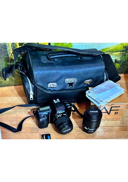 Nikon F50 Fotoğraf Makinası 2 Lens ve Çantasıyla - Pili Bitiktir Değişmesi Lazım - Çalışır