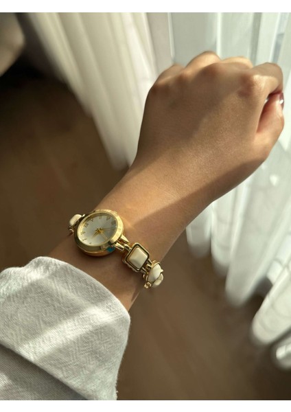 Yuvarlak Kadranlı Beyaz Taşlı Kordon Çelik Gold Kadın Yazlık Kol Saati - 36 fiyatları