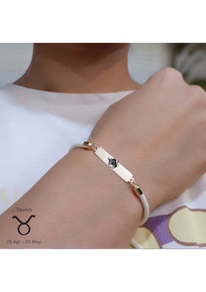 14 Ayar Altın Plakalı Boğa Burçlarına Dikdörtgen Figürlü Beyaz Örgü Ipli Hediye BILEKLIK-413BURÇ fiyatları