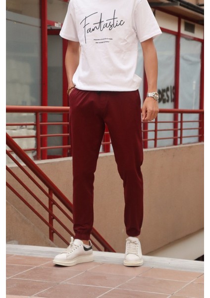 Bel ve paça lastikli, gabardin kumaş, bordo jogger pantolon