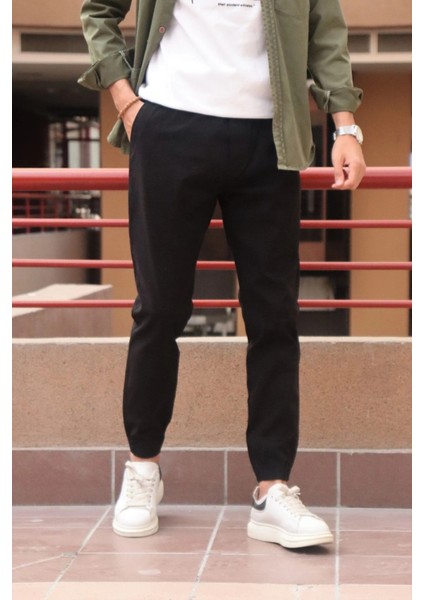 Bel ve paça lastikli, gabardin kumaş, siyah jogger pantolon