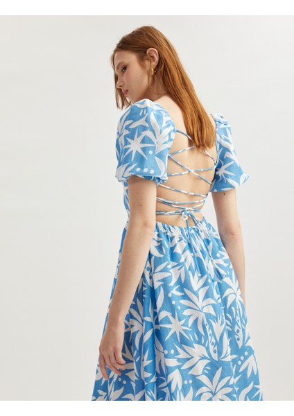 Pamuklu Kısa Balon Kollu Arkası Dekolte Detaylı Midi Boy Çiçekli Elbise