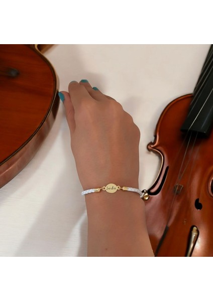 Seda İsmine Özel Doğal Beyaz Derili Oval Motifli 14 Ayar Altın Plakalı Hediye