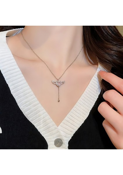 Aşkın Melek Dokunuşu - Melek Kanadı ve Kalp Figürlü Çelik Kolye - Pembe Zirkon fiyatları