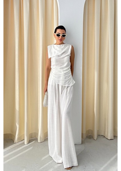 Beyaz Yaka Detaylı Asimetrik Kesim Bluz ve Pantolon Takım fiyatları