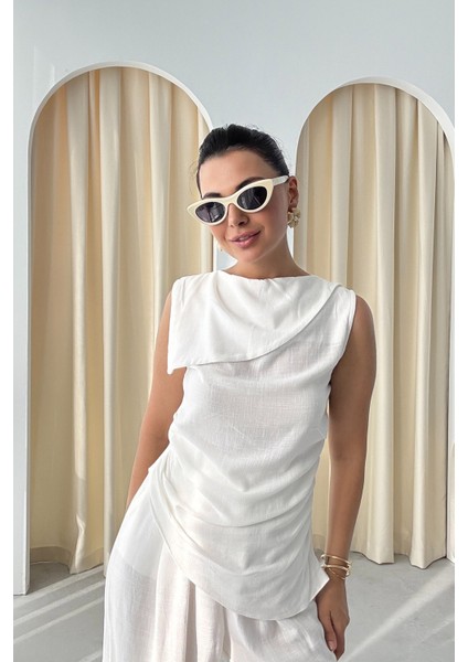 Beyaz Yaka Detaylı Asimetrik Kesim Bluz ve Pantolon Takım indirimleri