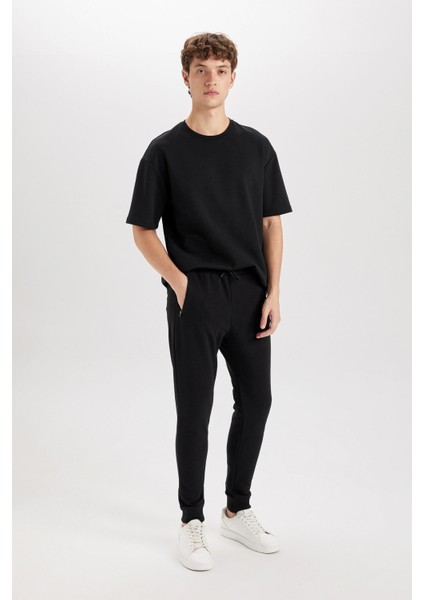 Jogger Eşofman Altı Slim Fit Dar Kesim Beli Bağcıklı Lastikli Paça Fermuar Cepli A4387AX24AU modelleri