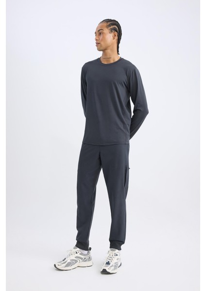 Fit Sporcu Jogger Eşofman Altı Standart Fit Beli Bağcıklı Basic Düz Lastikli Paça Cepli D1901AX24AU modelleri