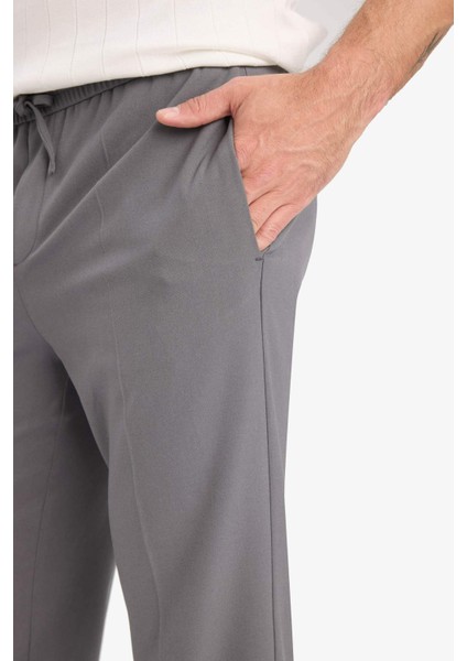 Beli Bağcıklı Lastikli Cepli Jogger Fit Her Yöne Esneyen Yumuşak Tuşe Pantolon A9943AX25AU indirimleri