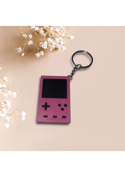 Retro Gameboy Tasarımlı Koyu Pembe Mini Konsol Anahtarlık – Nostalji Tutkunları Için Özel Aksesuar! fiyatları