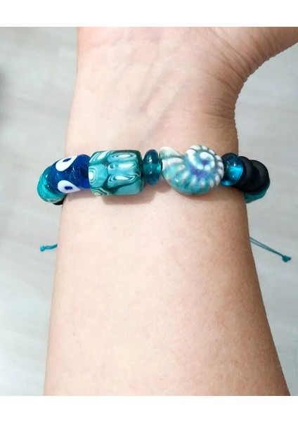 Bodrum Cam Nazar Seramik Salyangoz Ve Turkuaz Rengi Gana Krobo Cam Boncuklu Bileklik fiyatları