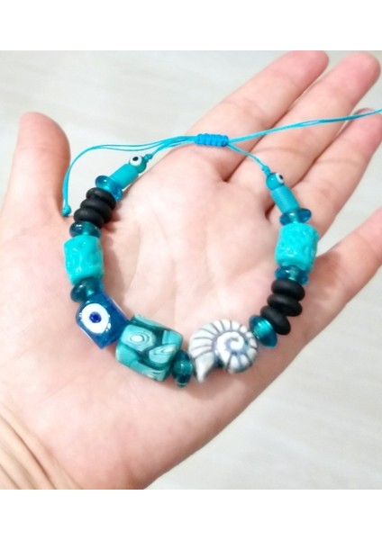 Bodrum Cam Nazar Seramik Salyangoz Ve Turkuaz Rengi Gana Krobo Cam Boncuklu Bileklik modelleri