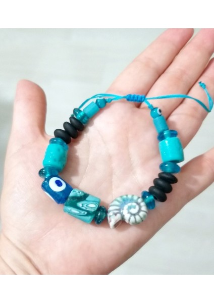 Bodrum Cam Nazar Seramik Salyangoz Ve Turkuaz Rengi Gana Krobo Cam Boncuklu Bileklik