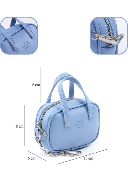 Mavi SHK210 Suni Deri Tek Bölmeli Fermuarlı El Çantası ve Charm Çanta Aksesuarı fırsatları