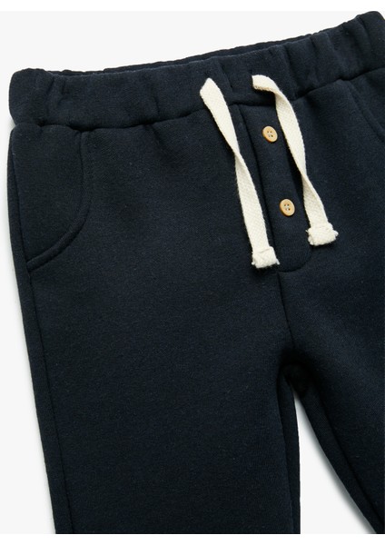 Şardonlu Duble Paça Düğmeli Bağcıklı Eşofman Altı modelleri