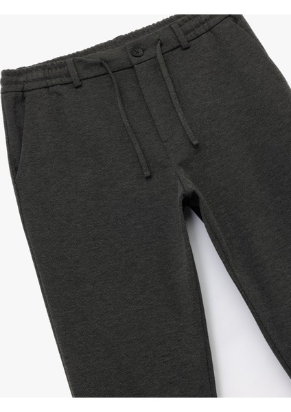 Beli Bağcıklı Düğmeli Pike Kumaş Cep Detaylı Duble Paça Slim Fit Pantolon modelleri