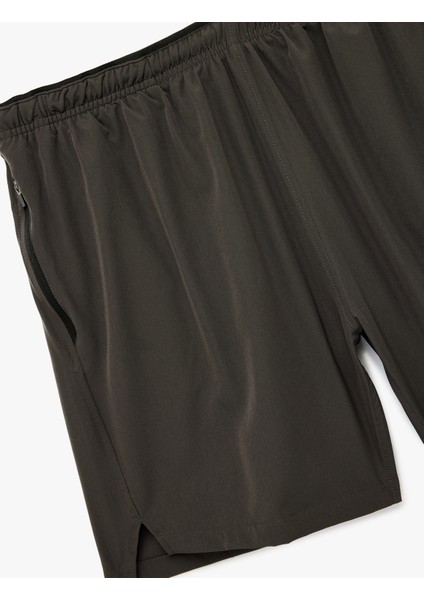 Fermuarlı Cepli Paraşüt Kumaş Yırtmaç Detaylı Oversize Beli Lastikli Spor Şort modelleri