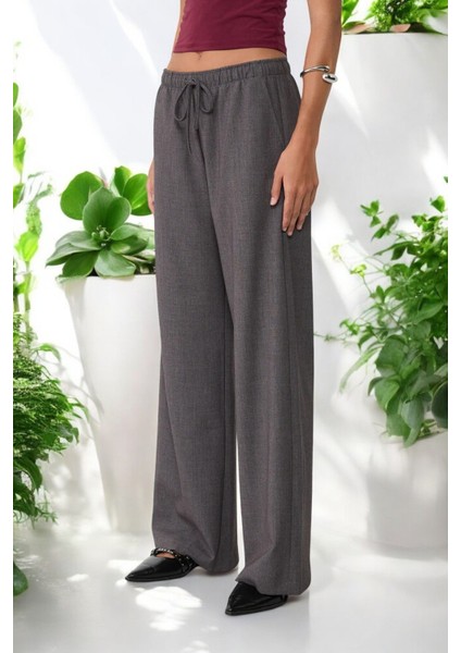 Lastikli Bel Bağcık Detaylı Dökümlü Geniş Paça Pantolon