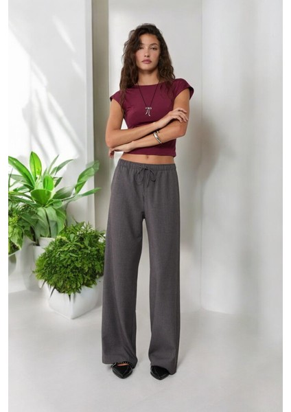 Lastikli Bel Bağcık Detaylı Dökümlü Geniş Paça Pantolon fiyatları