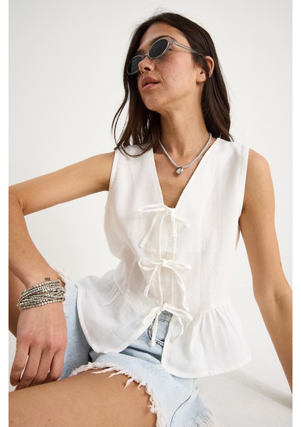 Kadın V Yaka Fiyonk Detaylı Müslin Peplum Bluz G- fiyatları