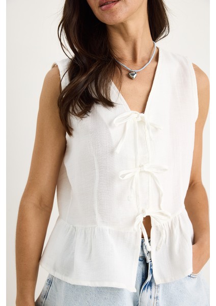 Kadın V Yaka Fiyonk Detaylı Müslin Peplum Bluz G- fırsatları