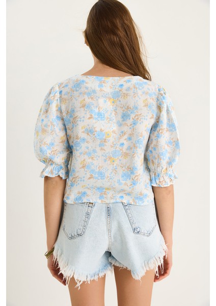 Kadın Çiçek Desenli Bağlama Detaylı Kolları Lastikli Müslin Bluz indirimleri