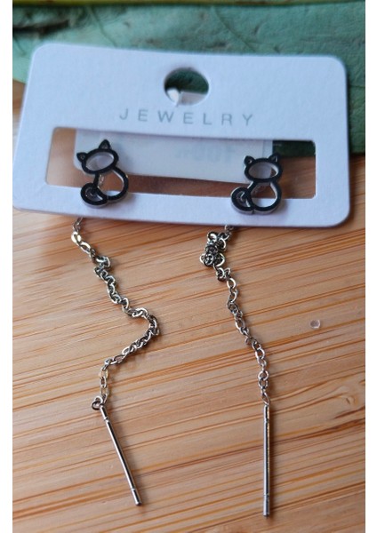 Gümüş Renk Metalik Figürlü Sallantılı Küpe