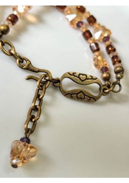 THİNBLACK BAYAN BİLEKLİK KRİSTAL TAŞLI KELEBEK FİGÜRLÜ ANTİK ALTIN RENGİNDE BİLEKLİK fiyatları