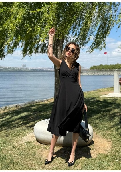 Mottisfashion Kadın Ithal Krep Kumaş Kruvaze Yaka Eteği Kloş Kolsuz Mini Elbise modelleri