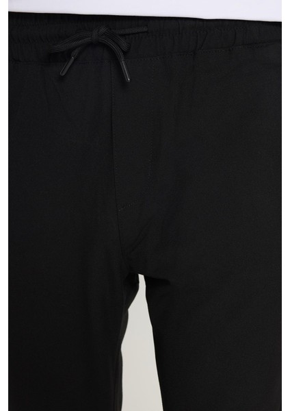 Erkek Slim Fit Dar Kesim Pamuklu Lastikli Beli Bağcıklı Siyah Pantolon modelleri